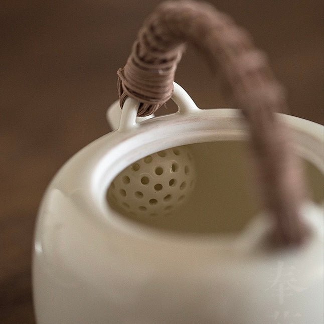 White ceramic teapot rattan woven handle teapotteapotsAnyee TeaWhite ceramic teapot rattan woven handle teapot