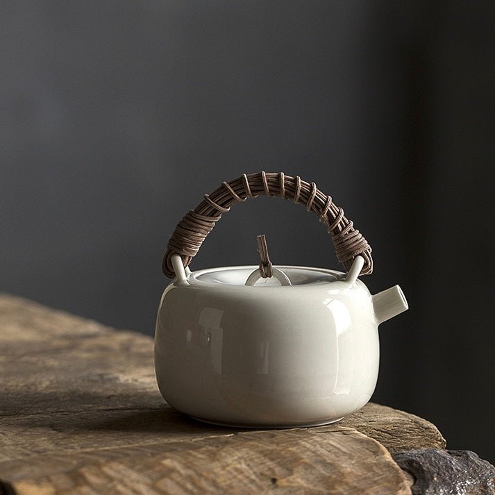 White ceramic teapot rattan woven handle teapotteapotsAnyee TeaWhite ceramic teapot rattan woven handle teapot