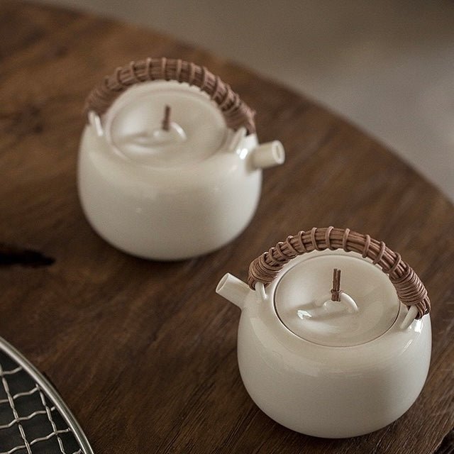 White ceramic teapot rattan woven handle teapotteapotsAnyee TeaWhite ceramic teapot rattan woven handle teapot